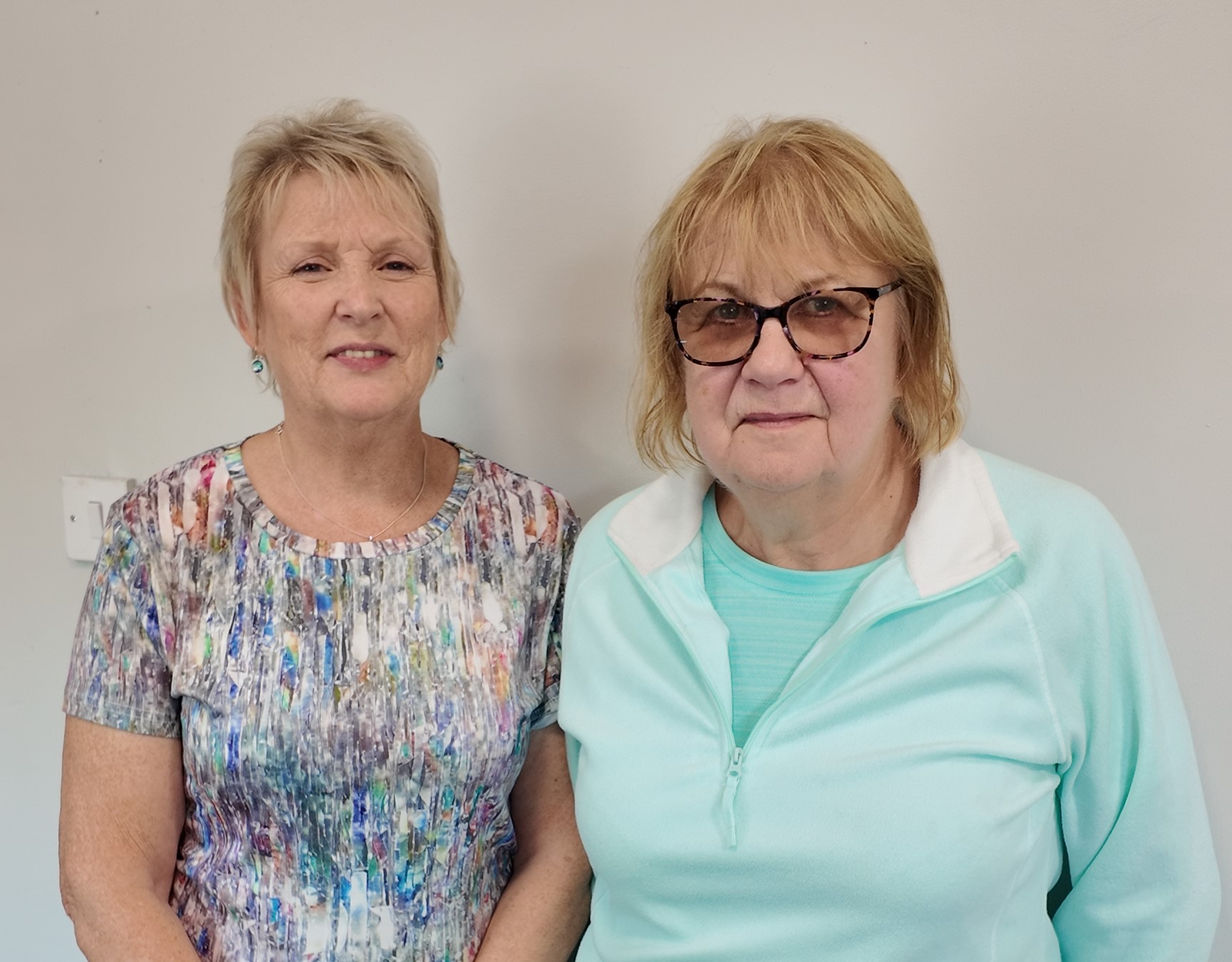 Two ladies smiling